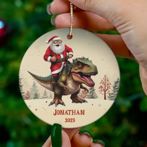 Custom Personalized Santa Riding Dinosaur Ornament, Christmas Dinosaur Gift, Funny Kids Xmas Keepsake Gift, T-Rex Dinosaur Tree Decor
