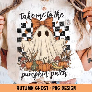 May include: A cream-colored graphic tee featuring a cartoon ghost with a bow, surrounded by pumpkins, mushrooms, and wheat. The text reads "take me to the pumpkin patch." The design includes a black and white checkered background and falling leaves. "Autumn Ghost - PNG Design" is written at the bottom.