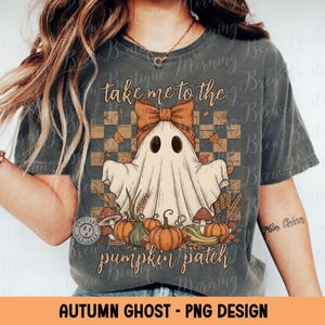 May include: Dark gray t-shirt featuring a cartoon ghost with a bow, surrounded by pumpkins and fall foliage. The text "take me to the pumpkin patch" is above the ghost. The words "Autumn Ghost - PNG Design" are at the bottom.