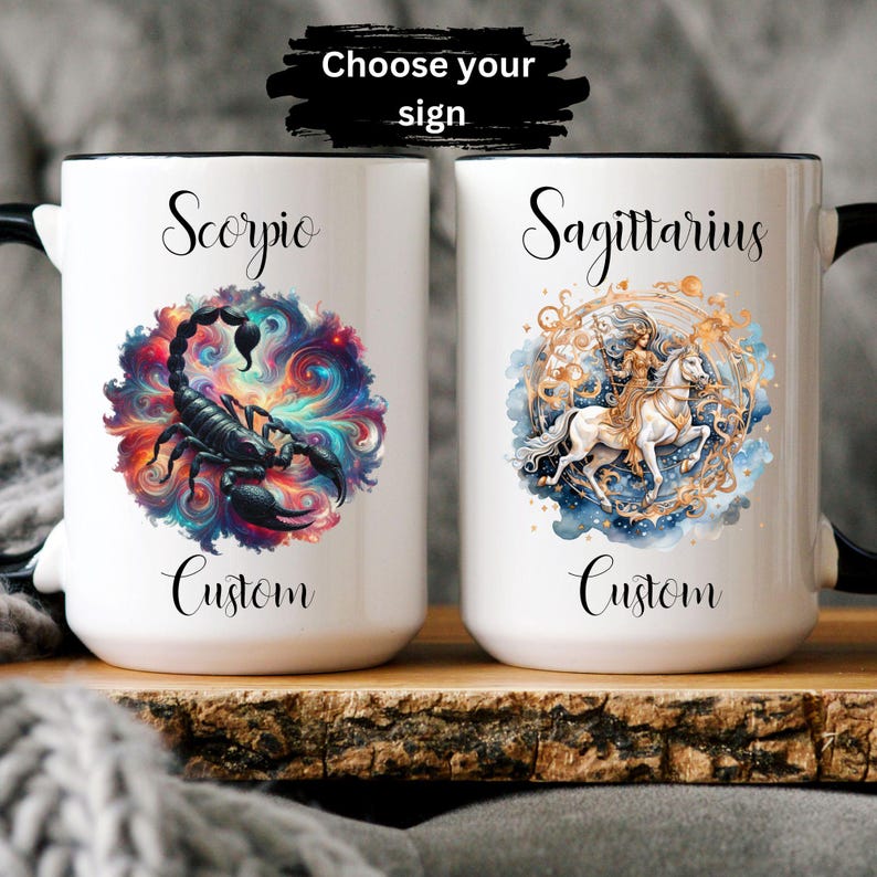May include: Two white ceramic mugs with black rims. The mug on the left features a colorful galaxy design with a black scorpion. The mug on the right features a watercolor design of a woman riding a white horse with gold accents. Both mugs have the word "Custom" printed below the design. The text "Choose your sign" is printed above the mugs.