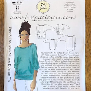 May include: A sewing pattern for a loose-fitting, dolman-style top with a boat neckline. The pattern includes sizes 6-26 and is available in one envelope. The pattern is called "Fast & Fabulous Milano Dolman T's" and is from the website www.hotpatterns.com.