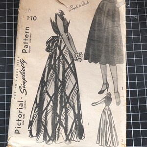 May include: A vintage Simplicity pattern, number 2024, featuring illustrations of dresses. The designs include a plaid and striped gown. The cover is aged, with the text "Simple to Make" and "Pictorial-Simplicity Pattern".