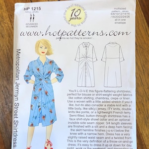 May include: Sewing pattern for a Metropolitan Jermyn Street Shirtdress. The pattern is for sizes 6-26 and includes instructions for a button-up shirt dress with a twisted front and 3/4 length sleeves. The pattern is from Hot Patterns and is labeled as an advanced beginner project.