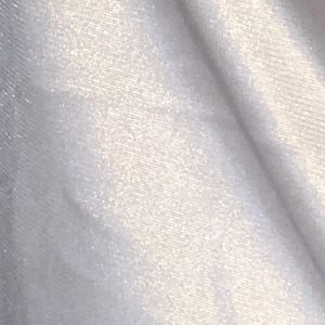 May include: Close-up of a white, textured fabric with a subtle sheen. The material appears to be soft and flowing, with visible diagonal folds and a slight shimmer, suggesting a luxurious textile.