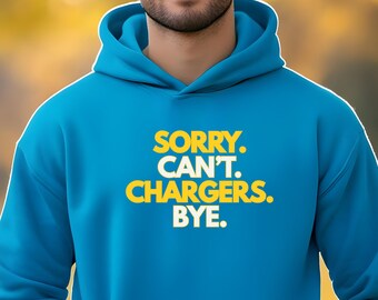 May include: A blue hooded sweatshirt with the text "SORRY. CAN'T. CHARGERS. BYE." in yellow and white. The sweatshirt has a drawstring hood and a kangaroo pocket.