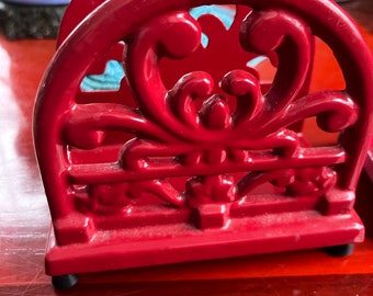 A Pair of Red Cast Iron Napkin or Letter Holders One of these is more faded than the other. Pictures will reflect this.