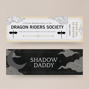 May include: A black and white ticket with a dragon design and the text "Lifetime Membership to the DRAGON RIDERS SOCIETY. Only the fiercest readers survive the storm." and "READER OF THE SKIES. ADMIT ONE:". Below the ticket is a black banner with a crescent moon and clouds and the text "SHADOW DADDY".