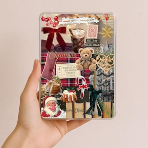 May include: Clear phone case with a Christmas-themed collage. The design includes a red bow, a teddy bear, a cup of coffee, a Christmas stocking, and a Santa Claus illustration. The text "Christmas" and "Merry Christmas" are visible.
