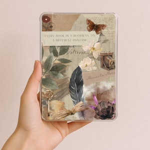 May include: Clear tablet case with a collage design featuring a butterfly, flowers, a vintage camera, and a key. The text "EVERY BOOK IS A DOORWAY TO A DIFFERENT UNIVERSE" is printed on the case.