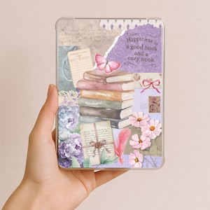 May include: A clear phone case with a collage design featuring books, flowers, a butterfly, and the text "Happiness is a good book and a cozy nook." The design incorporates vintage paper elements and a soft color palette.
