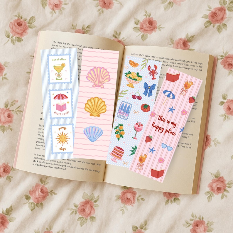May include: Four rectangular paper bookmarks featuring colorful illustrations. One has blue stripes and icons of a drink, a book under an umbrella, and a sun. Another has pink waves and three seashells. Two others feature patterns of fruit, food, and summer items.