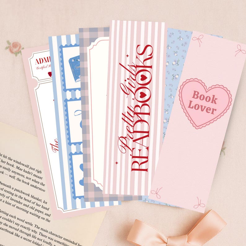 May include: A collection of decorative bookmarks in various designs. The bookmarks feature pastel colors, stripes, floral patterns, and text that reads "Pretty Girls Read Books" and "Book Lover".