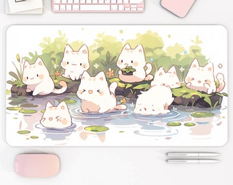 May include: A white mouse pad with a design of seven white cartoon cats playing in a pond with green lily pads. The cats are all different poses and have pink noses and whiskers.
