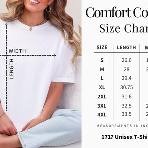 May include: White Comfort Colors unisex t-shirt with a size chart. The chart displays measurements in inches for sizes S to 4XL. The text "1717 Unisex T-Shirt" is at the bottom. The image also shows a person wearing the t-shirt.