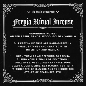 May include: Black and white graphic with ornate border. Text reads "the lucid graveyard" and "Freyja Ritual Incense." Fragrance notes: amber resin, sandalwood, golden vanilla. Incense is hand-dipped in small batches.