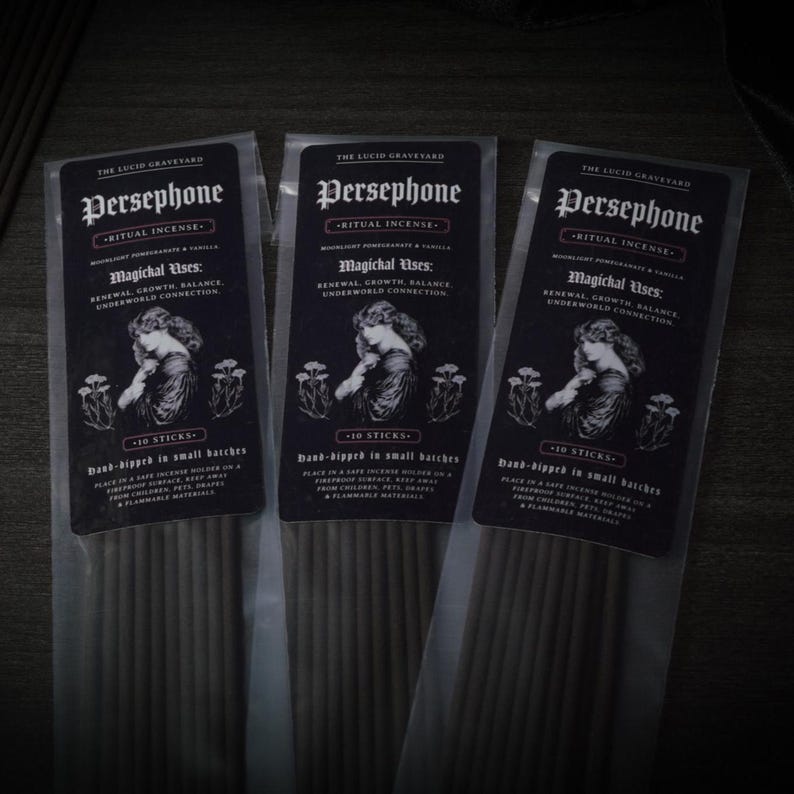 May include: Three packets of Persephone ritual incense. Each packet features a black label with white text and an illustration of a woman. The text includes "Magichal Uses: Renewal, Growth, Balance, Underworld Connection" and "10 Sticks".