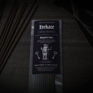May include: A package of Hekate ritual incense sticks from The Lucid Graveyard. The black label features the name "Hekate", the words "Ritual Incense", and a graphic of two figures. The package contains 10 hand-dipped sticks.