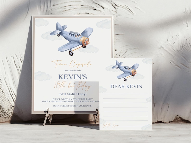 May include: A blue and white time capsule sign with a watercolor illustration of a blue airplane. The sign says "Time Capsule" and "Kevin's 18th Birthday" with the date "10th March 2042". There is a separate white card with the words "Dear Kevin" and lines for writing.