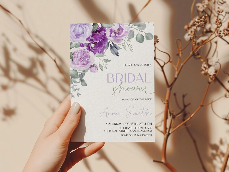 May include: A purple and green floral bridal shower invitation with the text "PLEASE JOIN US FOR A BRIDAL SHOWER IN HONOR OF THE BRIDE Anna Smith SATURDAY, DEC 13TH AT 3 PM LE GRAND FLORAL CAFE 81 FLORAL STREET, SAN FRANCISCO RSVP SOFIA 123-456-7890"