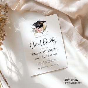 May include: A white graduation party invitation with a black mortarboard and floral design. The invitation reads "Grad Party" and includes details for Emily Johnson's celebration, including the date, time, and location. The invitation is 5x7 inches.