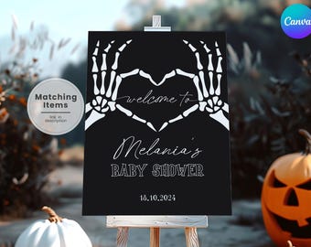 May include: Black sign with white skeleton hands forming a heart shape, with the words "welcome to" above "Melania's BABY SHOWER" and the date 10/18/2024. The sign is on an easel, with pumpkins in the background.