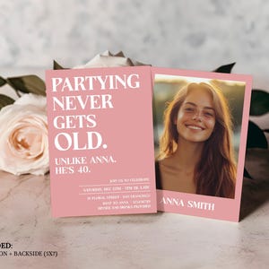 May include: Pink invitation card with the text "Partying Never Gets Old. Unlike Anna. He's 40." and a photo of a woman with brown hair smiling. The text "Join us to celebrate Saturday, Dec 12th 7PM til late 41 Floral Street, San Francisco RSVP to Anna" is also on the card.