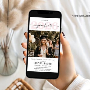 Modern digital graduation invitation showing a rectangular photo frame atop a soft pink watercolor brushstroke background, bold black serif lettering reading Class of 2026, minimalist sans-serif text below for name and event details, designed as a mobile-friendly evite or printable announcement.