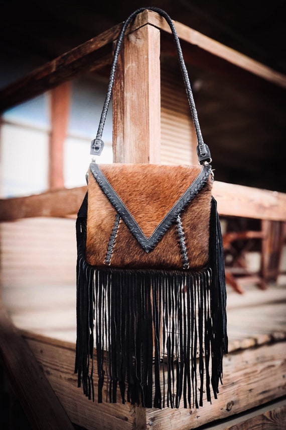 The Elva-Rustic brown leather cowhide purse with black fringe