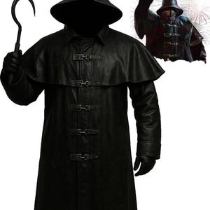 May include: A black hooded coat with a cape and three buckle fastenings. The coat is worn with black gloves and a hook. A smaller image of the coat is in the upper right corner.