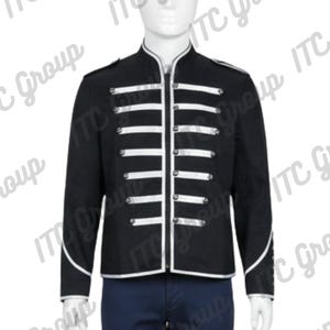 May include: Black jacket with white stripes and silver buttons. The jacket has a stand-up collar and white trim along the edges. The jacket is displayed on a mannequin. The jacket is part of a clothing collection.
