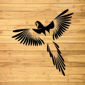 May include: A black silhouette of a parrot with its wings spread out. The parrot is facing to the left and has a long tail. The image is on a woodgrain background.