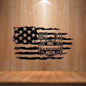 May include: Black and white distressed American flag design with the words "Grill Master" in a shield shape. The shield is surrounded by flames and grilling tools.