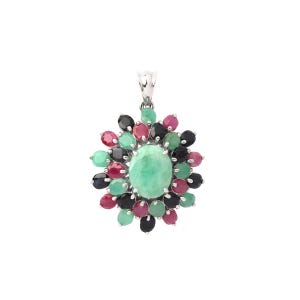 May include: A silver pendant with a central oval, light green gemstone, encircled by smaller gemstones in red, black, and green. The pendant has a floral design and a silver bail. The gemstones are set in a silver setting.