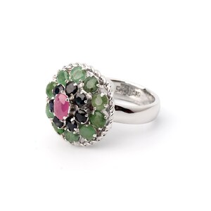Statement ring with ruby center stone, emerald ring and sapphire ring accents
