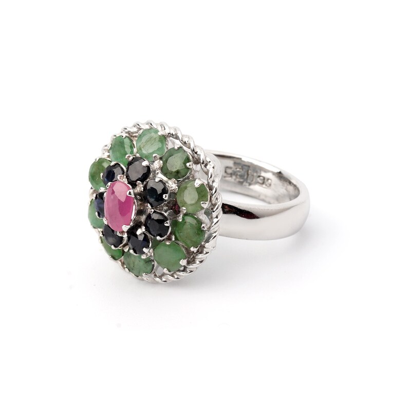 Statement ring with ruby center stone, emerald ring and sapphire ring accents