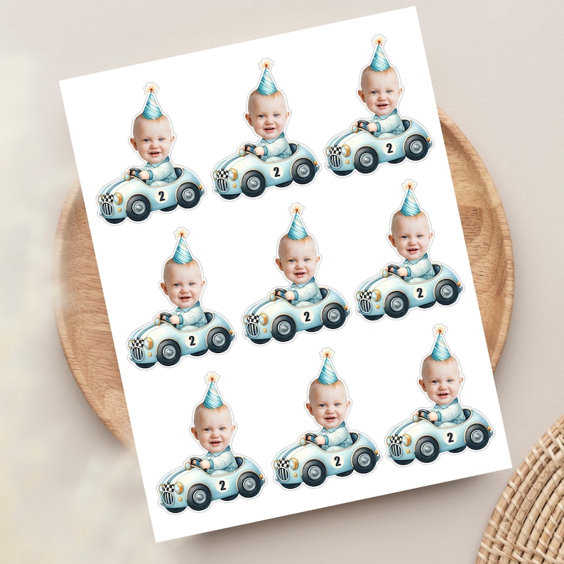 May include: Eight printable stickers featuring a baby in a blue race car with a blue and white chequered flag. The baby is wearing a blue and white party hat and the car has the number 2 on it.