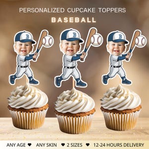 May include: Three cupcakes with white frosting, each topped with a baseball-themed cake topper. The toppers feature a cartoon image of a child in a baseball uniform holding a bat and ball. Text on the image reads "PERSONALIZED CUPCAKE TOPPERS BASEBALL".