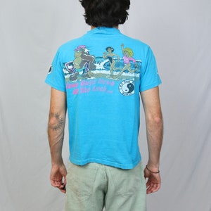 Vintage 80s T&C Surf designs Hawaii t shirt M Hanes Light blue some guys have all the luck thrilla gorilla graphic tee made in USA image 1