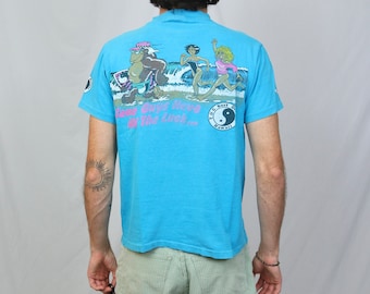 Vintage 80s T&C Surf designs Hawaii t shirt (M) Hanes Light blue some guys have all the luck thrilla gorilla graphic tee made in USA