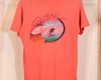 Vintage 70s Surf Shop T Shirt (M) Interlight Pensacola Beach Florida Pink Surfer Graphic tee made in USA California Shirts tag