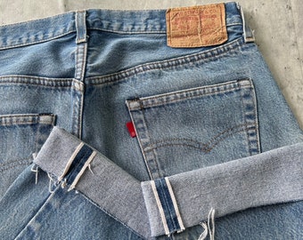 Vintage 80s Selvedge Levi's 501 Jeans (32) líneas rojas botón de mezclilla mosca hecha en EE.UU.