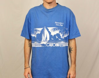 Vintage 80s University of San Diego California T Shirt (XL) Blue Wrap Around Print Graphic Beach 1981 Made in USA