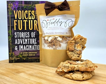 May include: A book titled "Voices of Future" next to a bag of "Teddy" Maple Cinnamon Toast Crunch Marshmallow Cookies. The book cover is purple and gold. The cookie bag is brown with a brown bow.