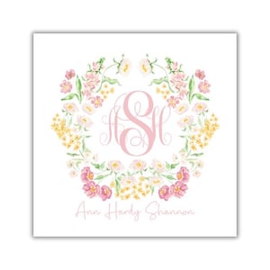 May include: Square card with a floral wreath design. The wreath features pink, yellow, and white flowers. A pink monogram with the letters "ASH" is in the center. The name "Ann Hardy Shannon" is written below the monogram.