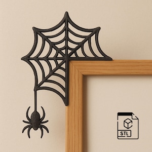 May include: A black spider web corner decoration with a dangling spider attached to the bottom, positioned on the top right corner of a light brown wooden frame. The image includes a small black icon with the text STL and a cube graphic.
