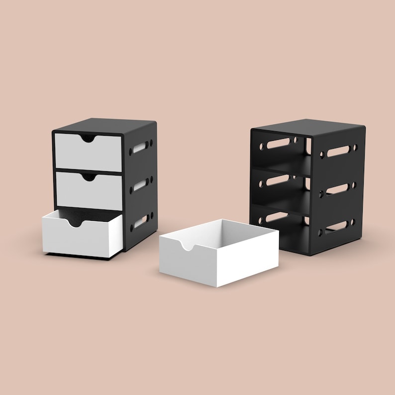 Puede incluir: Dos organizadores de almacenamiento negros con cajones blancos. Un organizador tiene tres cajones y el otro tiene tres estantes.