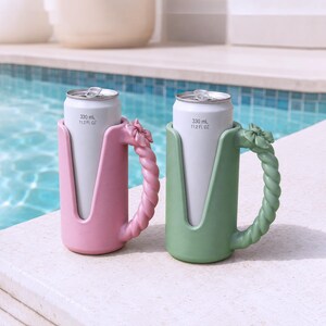 May include: Two beverage can holders, one pink and one green, each featuring a twisted rope-style handle with a small bow detail at the top. The holders are designed to fit standard 330 mL or 11.2 fl oz aluminum cans, which are inserted inside.