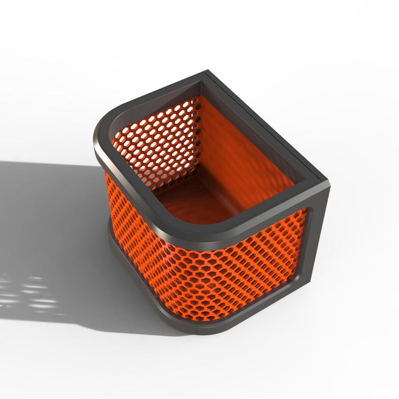 May include: A modern, angular desk organizer with a black frame and orange honeycomb mesh sides. The interior is also orange, creating a striking contrast. The design is sleek and contemporary, suitable for office or home use.