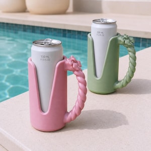 May include: Two beverage can holders, one pink and one sage green, each featuring a twisted rope-style handle with a small bow detail at the top. The holders are designed for 330 mL or 11.2 fl oz cans, which are inserted into the open-front sleeves.