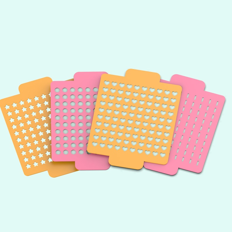 May include: Four different stencils, each with a different pattern. The stencils are orange, pink, and white. The patterns are stars, circles, hearts, and lines.